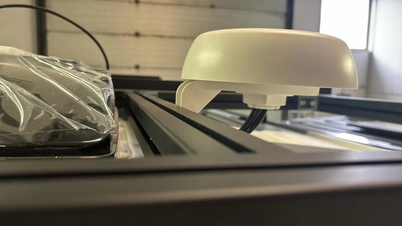 Peplink 42G antenna on the roof rack. It looks bigger than it actually is.